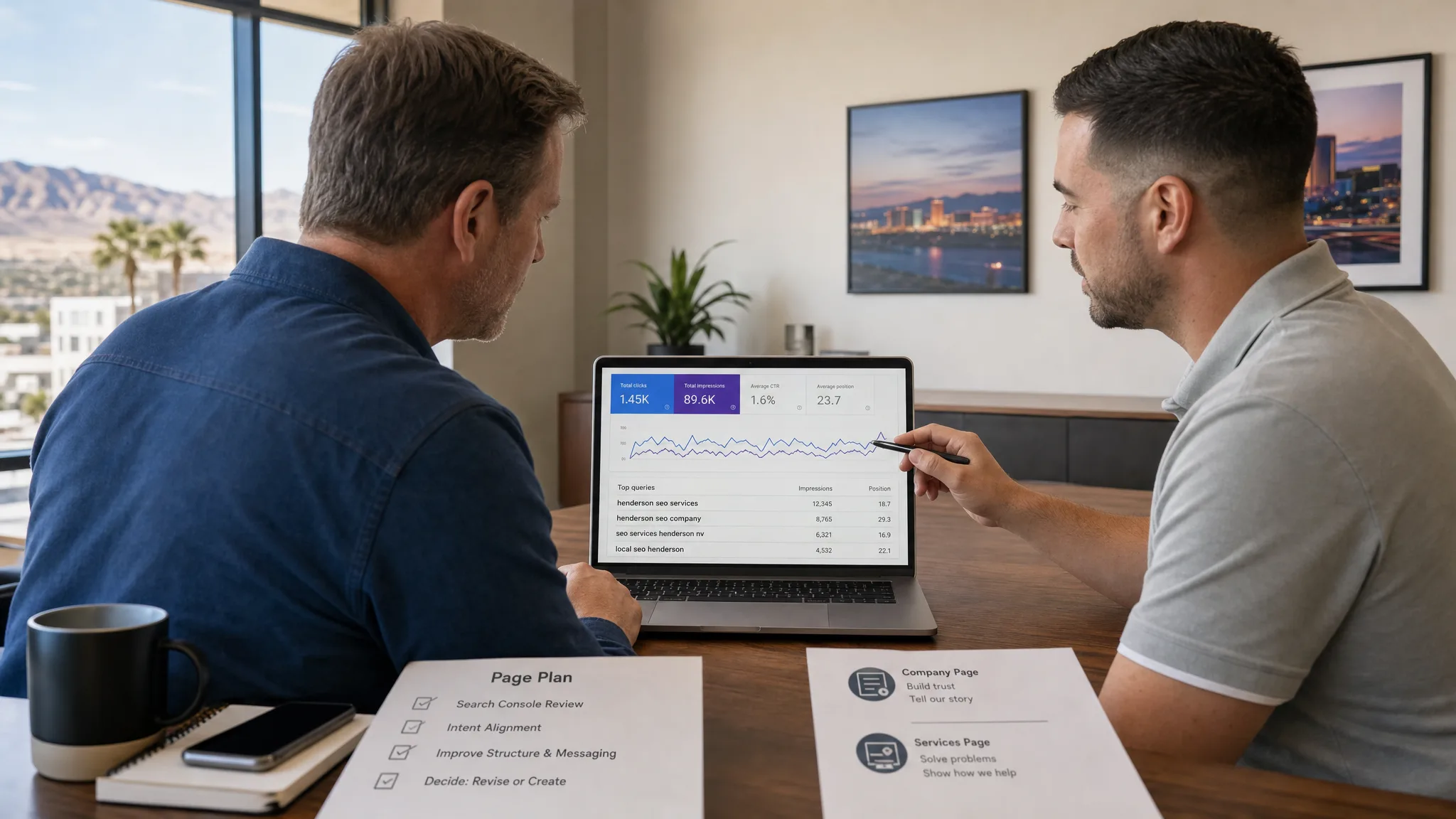Summerlin business owner reviewing SEO service search queries with a marketing consultant